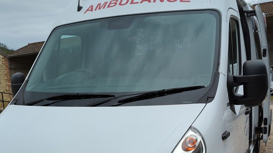 Ambulance-liveried secure transport vehicle